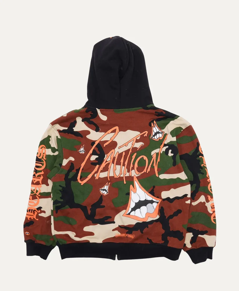 Chrome Hearts Matty Boy Zip-Up Hoodie Artistic Expression Meets Streetwear Luxury The Chrome Hearts Matty Boy Zip-Up Hoodie combines the rebellious energy of Chrome Hearts with the playful, artistic vision of Matty Boy. Featuring bold hand-drawn graphics and the brand’s signature street-luxury edge, this hoodie turns a casual classic into an expressive statement piece. Built for both comfort and individuality, it embodies the fearless spirit at the heart of Chrome Hearts. Premium Craftsmanship and Distinctive Design Made from heavyweight cotton, the Matty Boy Zip-Up Hoodie provides durability, warmth, and an unmistakably premium feel. Chrome Hearts’ iconic craftsmanship pairs seamlessly with Matty Boy’s bold graphics, creating a hoodie that is instantly recognizable. Custom hardware, embroidered accents, and meticulous detailing ensure this piece stands out as wearable art. Versatility with Artistic Edge Perfect for layering or wearing on its own, the Chrome Hearts Matty Boy Zip-Up Hoodie adapts easily to your style. Pair it with denim for a laid-back streetwear vibe, or wear it under a jacket to highlight its bold graphic elements. Its relaxed fit and zip-up design bring effortless versatility, making it a standout in any wardrobe. A Statement of Bold Creativity More than just outerwear, the Matty Boy Zip-Up Hoodie is a symbol of creativity, confidence, and individuality. With its daring artwork and signature Chrome Hearts detailing, it reflects an unapologetic approach to fashion — perfect for those who want their style to be both bold and artistic.